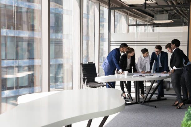 istock Multiethnic millennial business group of employees brainstorming on project 1424912390