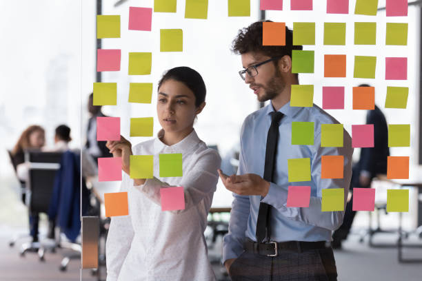 istock Diverse millennial employees, coworkers discussing project schedule 1424912718