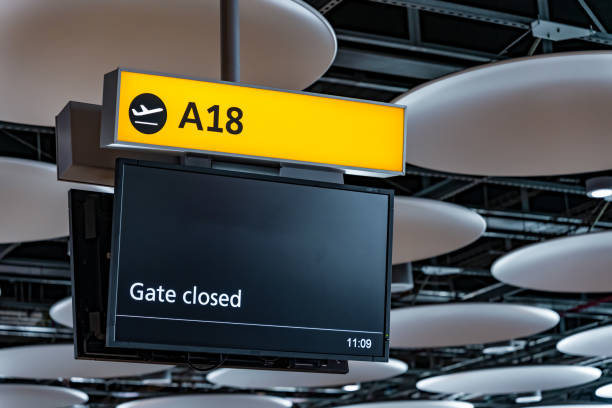 istock Gate closed airport flight/gate information board 1424917615