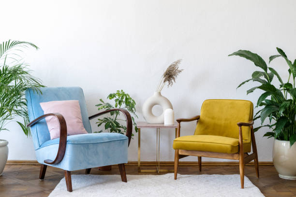 Bright apartment with retro armchairs and vintage home decor The pleasure of being at home concept. Interior in the style of the 80s. Furniture and apartment design. Retro armchairs, vintage decor and soft carpet in comfortable living room art deco vase stock pictures, royalty-free photos & images