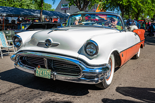 Falcon Heights, MN - June 18, 2022: High perspective front corner view of a 1956 Oldsmobile Super 88 Convertible at a local car show.