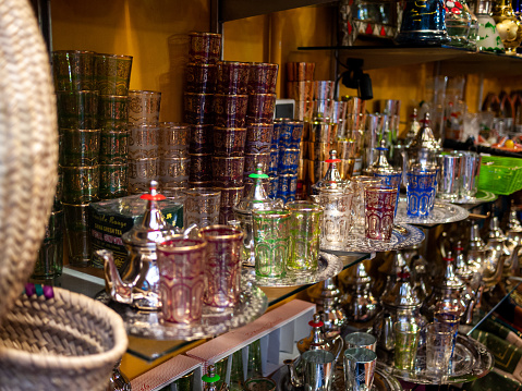 Arabic style tea glasses and teapots at a souvenir shop in the local market of Granada
