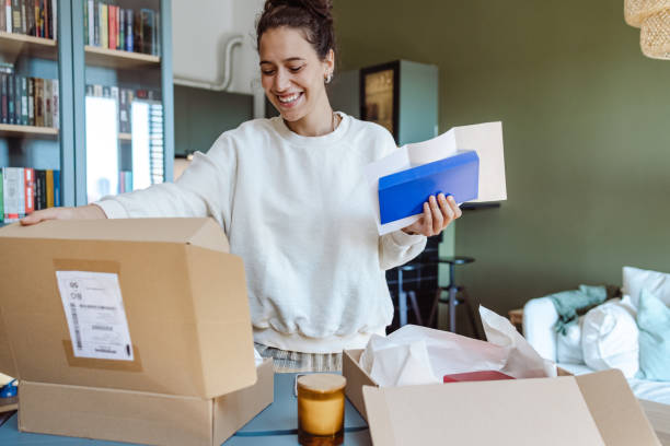 istock Cheerful young woman received an online order 1424927525