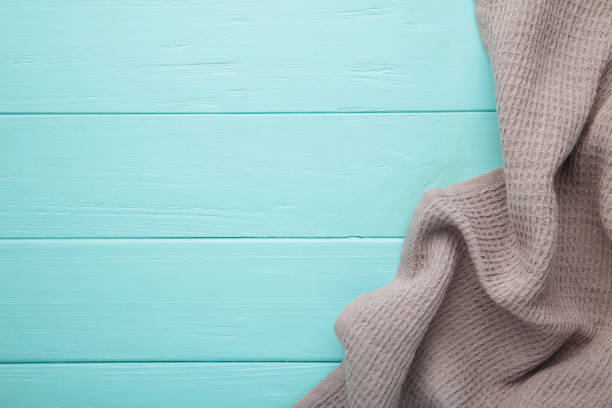 istock The checkered tablecloth on pink background. Decorative cotton napkin. 1424927895