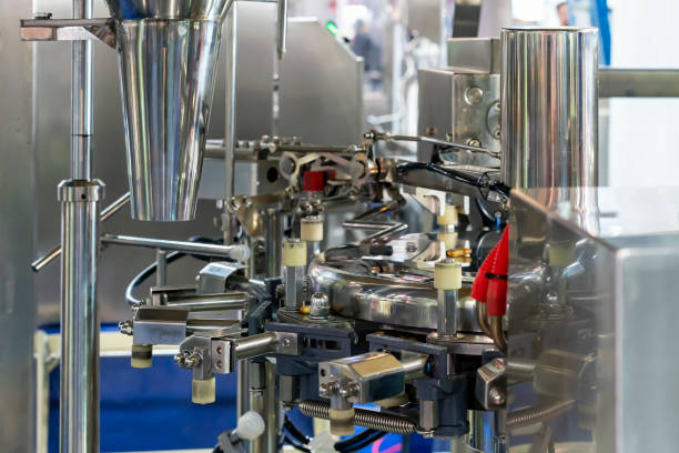 istock Detail component parts automatic bottle capping machine for continuous in manufacturing process 1424934747