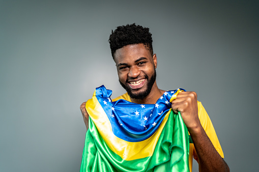 Male Brazilian athlete / fan celebrating