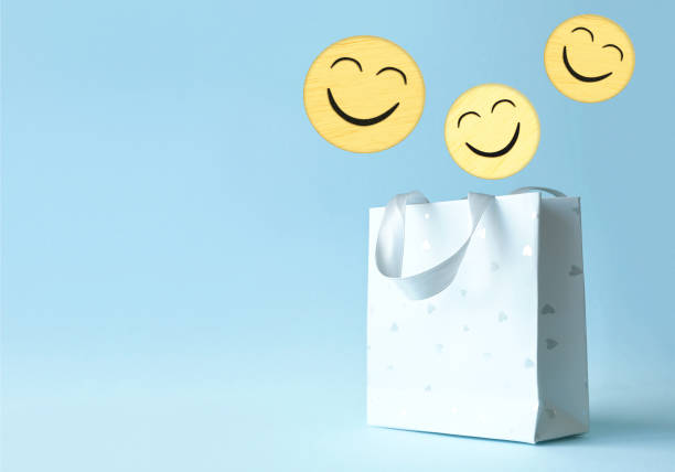 istock Paper shopping bag with smile face icon 1424940226