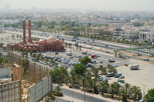 Aerial with of Kuwait City downtown with the Bader Al-Mailam Mosque and a large parking lot. Kuwait City. Kuwait.