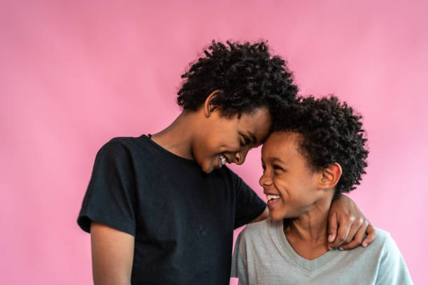 istock Brothers on a pink background 1424942736