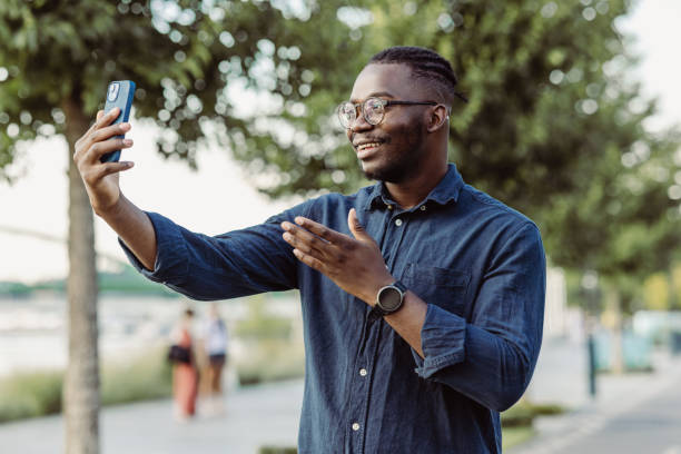istock A young man with eyeglasses talking on a video call 1424947103