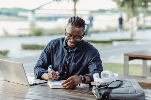 istock A young smiling man is working outdoors 1424948207