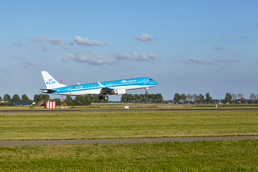 Vijfhuizen, The Netherlands - August, 20, 2022. The Embraer E190STD of KLM Cityhopper with the identification PH-EZR lands at Amsterdam Airport Schiphol (The Netherlands, AMS, runway Polderbaan).