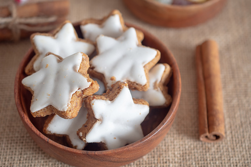 Christmas cookies in the shape of a star with white icing.