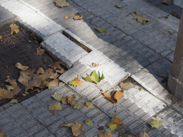 istock risk sidewalk tiles. Potholes, insecurity and risk 1424950358