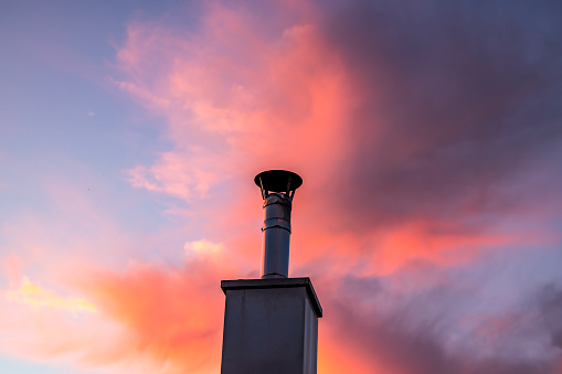 modern chimney add on funnel with colorful sunset background.