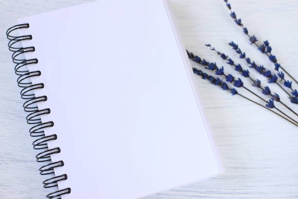 istock Blank notebook mockup and lavender flowers 1424955979