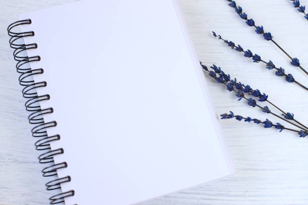 istock Blank notebook mockup and lavender flowers 1424956005