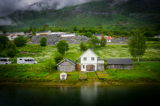 The Norwegian port of Olden, Norway, Europe. Typical Norwegian house at the side of the road near Olden, Norway.