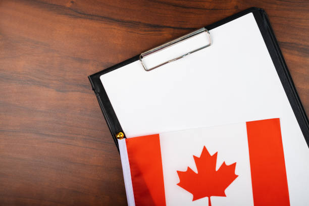 istock template for text on clipboard with Canadian flag, place for text document, laws, insurance, contract, record, Act 1424962760
