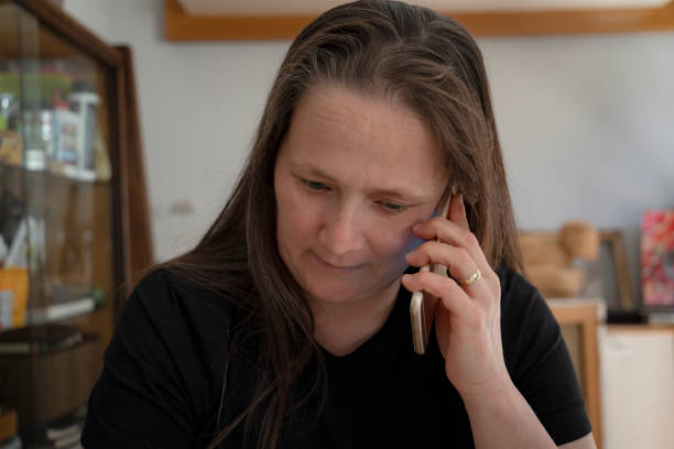 istock Mature woman talking on phone 1424963505