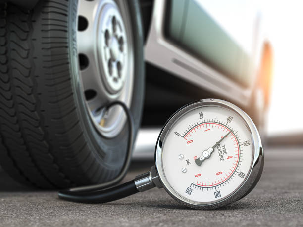 Tyre pressure gauge and car wheel. Inflation, inspection and measurement of wheel tyre. stock photo