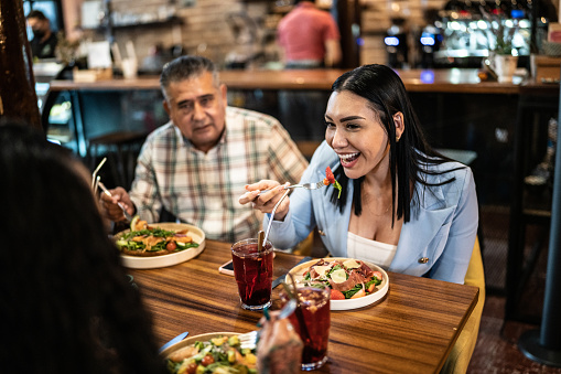 Coworkers having lunch together in a restaurant