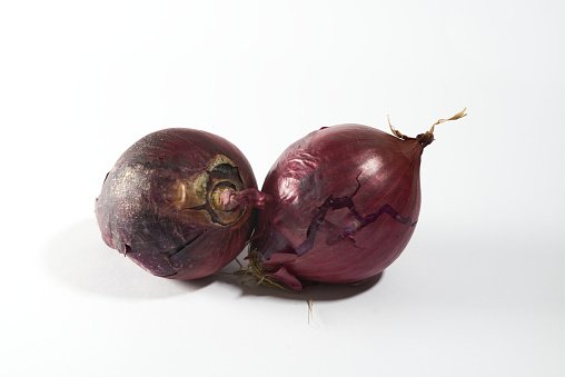 red onions on white isolated background