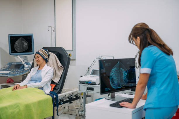 istock An Asian female radiologist analyzing scan results on computer monitors after female patient scanned by CT scanner in lab 1424974023