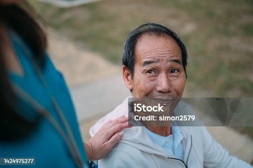 istock Senior Asian adult enjoys the outdoors with healthcare nurse 1424975277