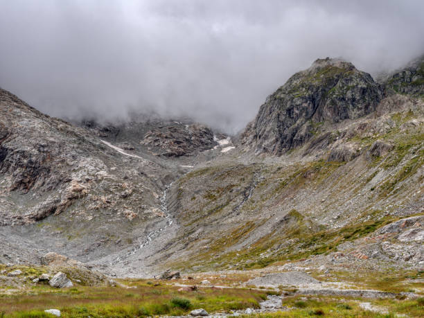 istock mountain creek in front of Steingletscher on Sustenpass 1424975529