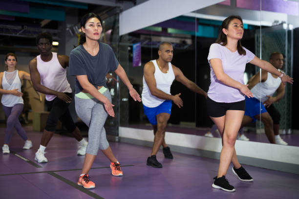istock People dancing aerobics at lesson in gym 1424977509