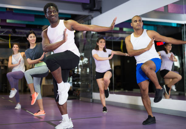 istock People dancing aerobics at lesson in gym 1424977521