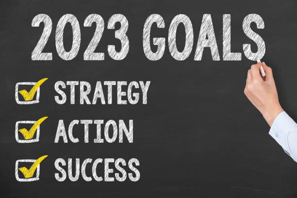 istock Human Hand Writing New Year 2023 Goals on Blackboard Background 1424977721