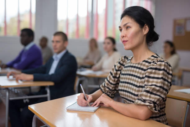 istock Young woman working during group business training 1424977738