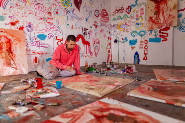 istock Artist working at his home art workshop 1424978514