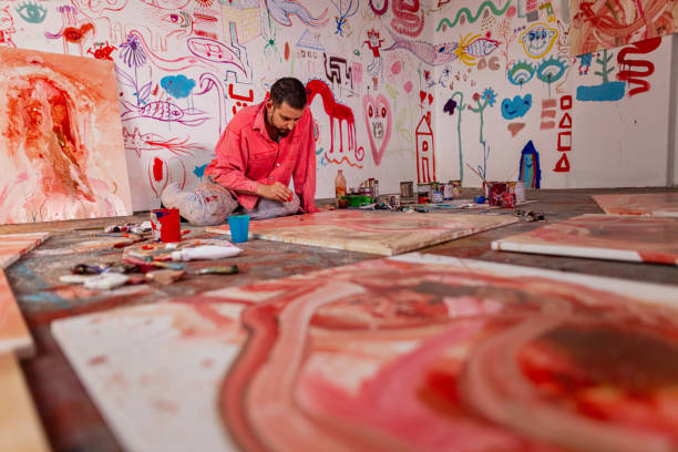 istock Artist working at his home art workshop 1424980750