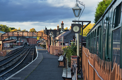 Bridgnorth,Shropshire,England,UK-October 25 2021:Authentic and still operational passenger rail cars stand at the Severn Valley Railway platform,in a traditional olden style setting.