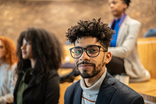 Portrait of a mid adult man in a seminar