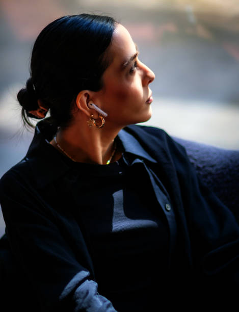 istock woman looking outside 1424984287