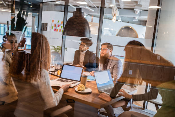istock Coworkers in a meeting at the office 1424984657