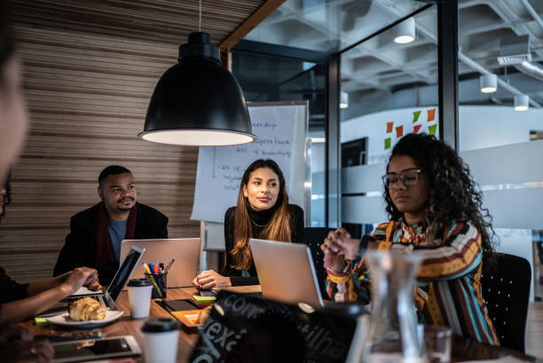 istock Coworkers in a meeting at the office 1424984871