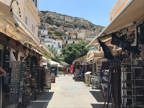 Greece - Crete- Matala Beach It is a beautiful sandy beach sheltered by cliffs caves, troglodyte tombs, carved into the rock, traditions of the Stone Age as well as a small tourist village