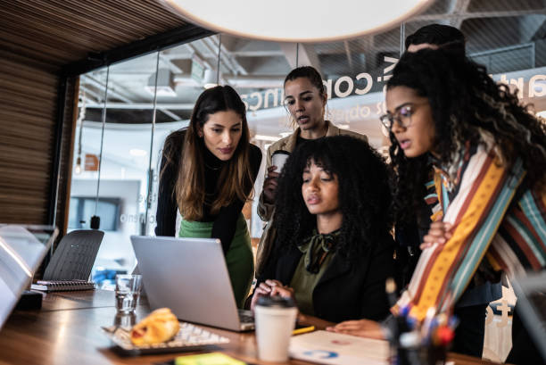 istock Coworkers doing a meeting using laptop at the office 1424986300