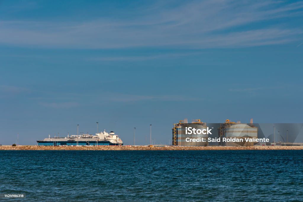 LNG tanker unloading gas at the Sagunto regasification plant, Spain. Liquefied Natural Gas Stock Photo