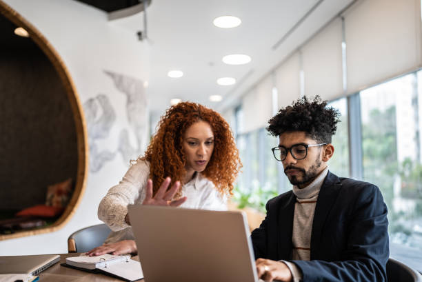 istock Coworkers in a meeting at the office 1424986477
