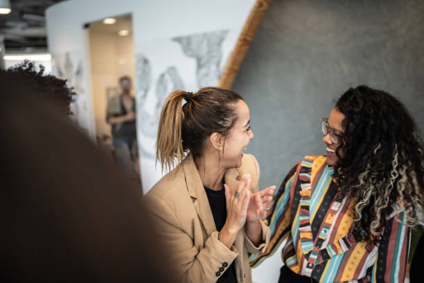 istock Coworkers celebrating at the office 1424986632