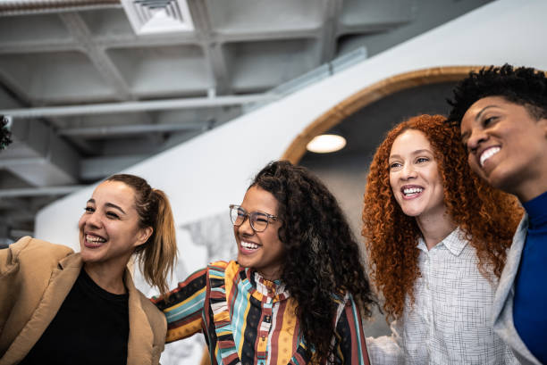 istock Coworkers talking at the office 1424986684