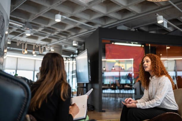 istock Coworkers in a meeting at the office 1424986826
