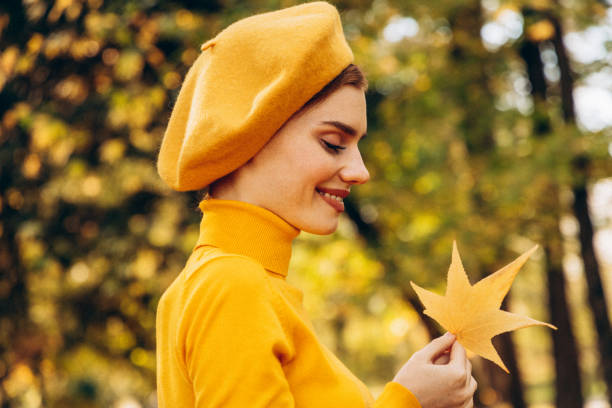 istock Beautiful woman enjoying autumn 1424988697