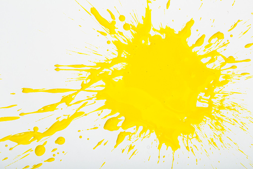 Deep yellow paint spot isolated on white background
